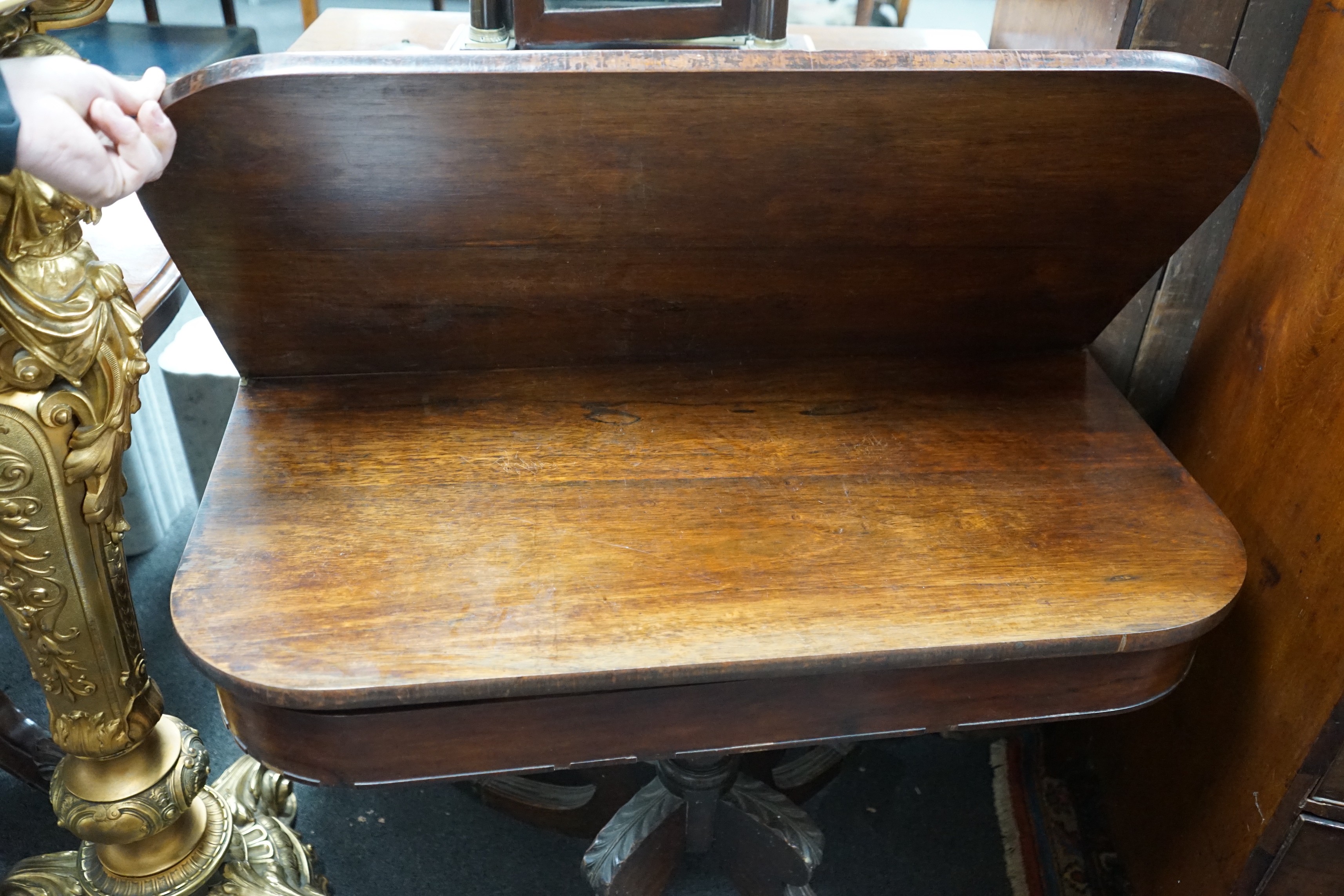 A Regency rosewood D shaped folding tea table, width 91cm, depth 45cm, height 72cm
